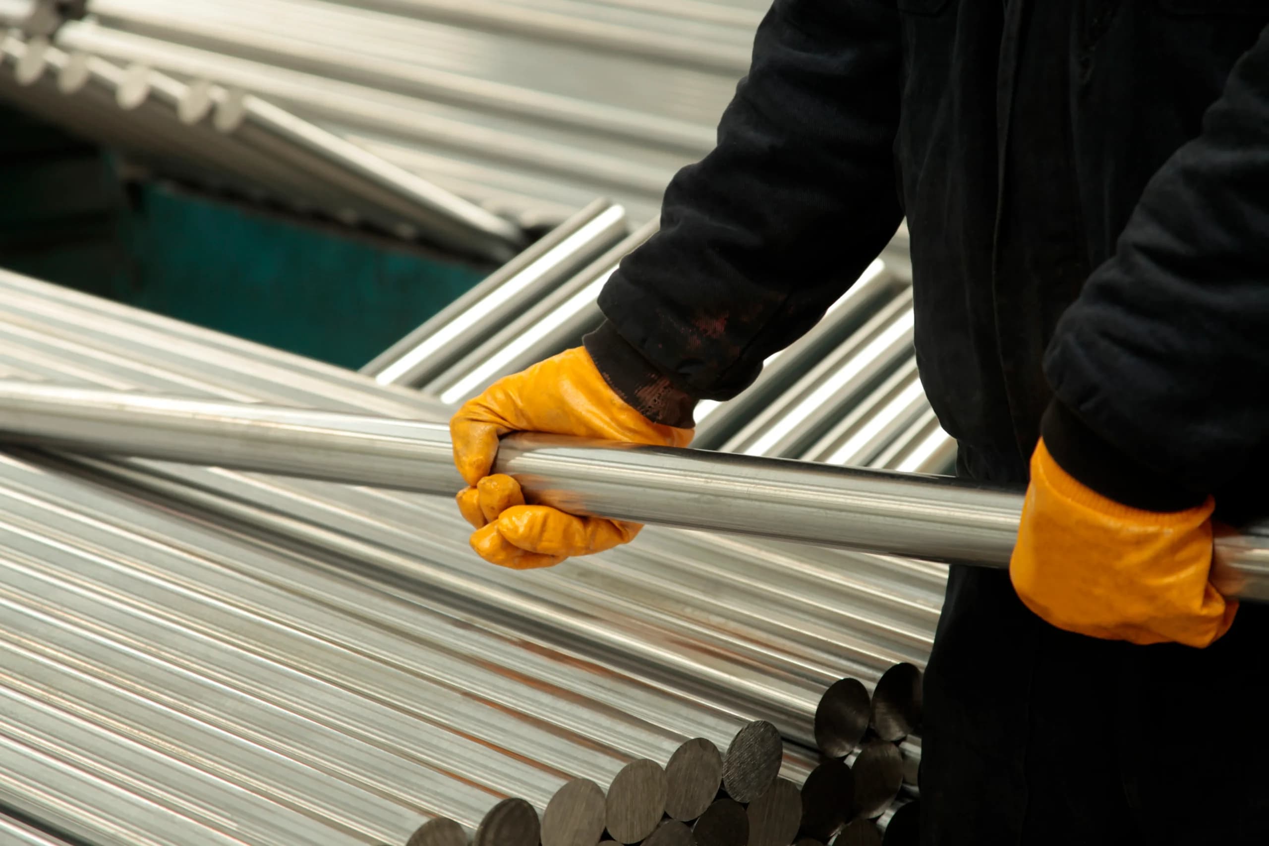 New steel pipes stacked at the Pipe Steel Industries factory